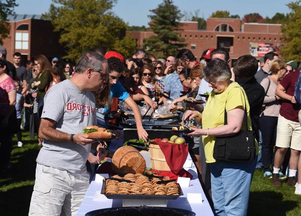 Groups of parents and student at a cookout